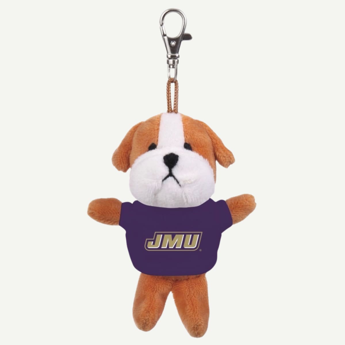 A plush bulldog keychain wearing a purple JMU shirt, featuring brown and white fur and a silver metal clasp at the top, set against a plain off-white background.