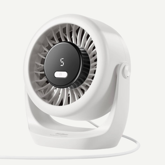 A compact white desk fan with a circular black control panel displaying '3' and a white cord, photographed on a clean off-white background.