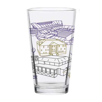 A clear pint glass featuring a line-art illustration of a stadium and buildings in purple and gold outlines, shown on a plain white background.