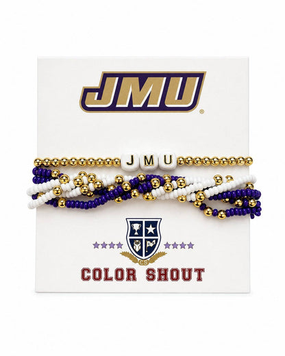 A set of JMU Color Shout beaded bracelets on a white display card. The bracelets include gold, purple, and white beads, with one flat gold beaded bracelet and three multi-strand bracelets featuring letter tiles spelling 'JMU'.