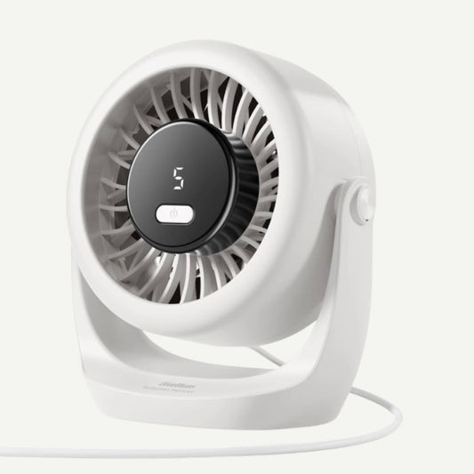 A compact white desk fan with a circular black control panel displaying '3' and a white cord, photographed on a clean off-white background.