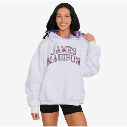 Person wearing a white hoodie with 'James Madison' text on a plain background