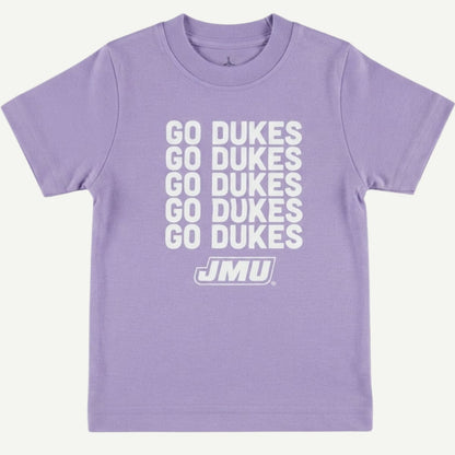 A light purple short-sleeve t-shirt with 'GO DUKES' printed in white stacked vertically on the front, with the JMU logo underneath, shown against a light off-white background.